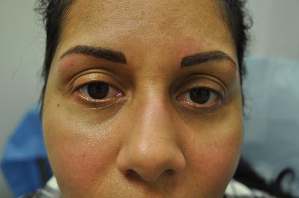 Close-up of a woman's face showing her eyebrows and eyes.